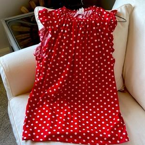 Cute sleeveless red with white polka dot top.  Never worn, but tags removed.